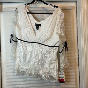 White lace top with black trim